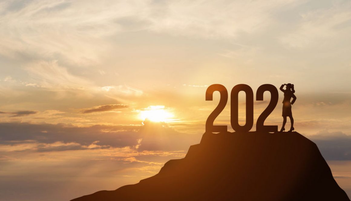 2021 standing on the top of a hill with a person representing the 1